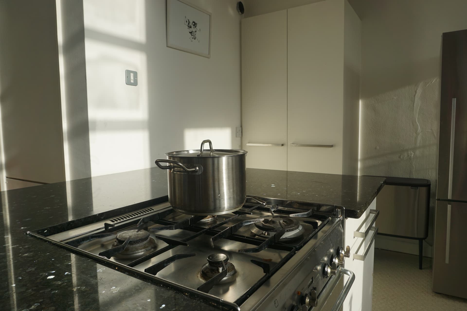 Kitchen with gas range and natural light
